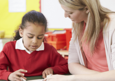 female teacher with little girl